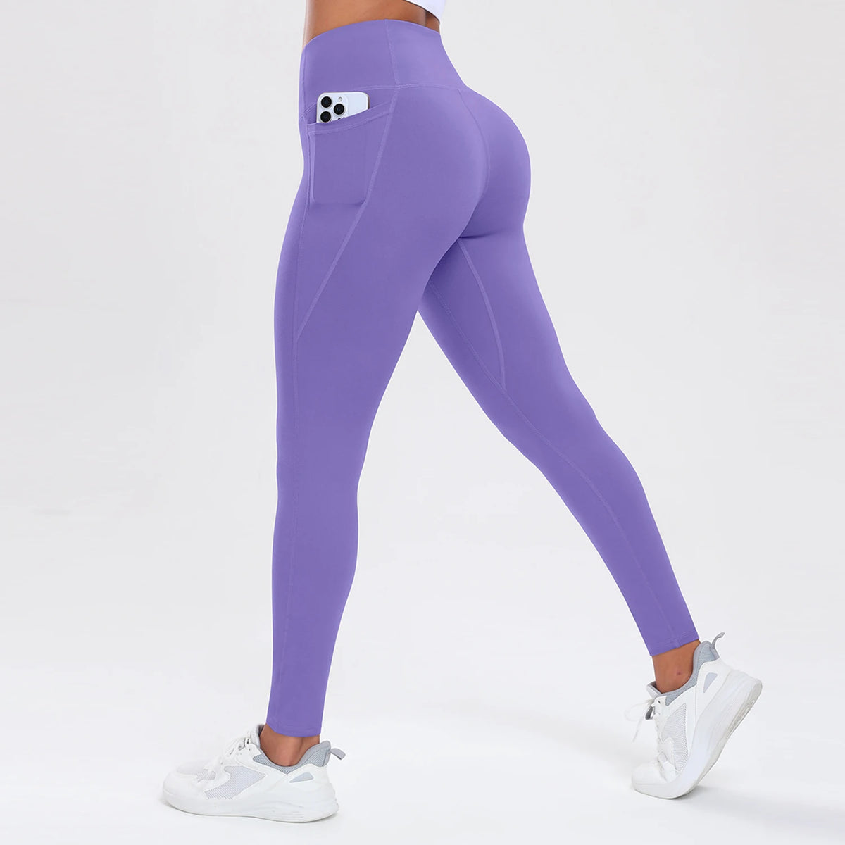 Purple leggings with a pocket on a white background